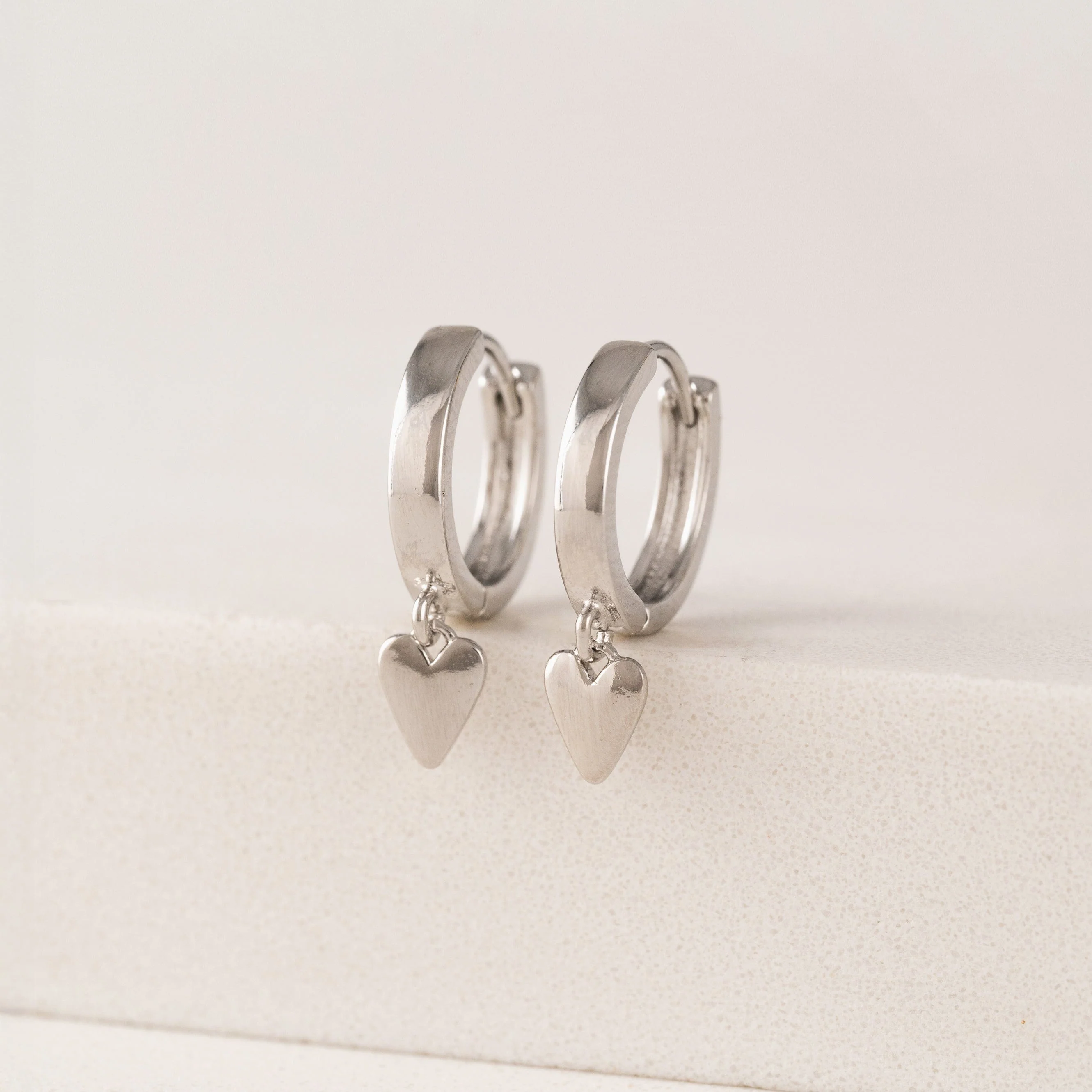 SILVER EVERLY HEART HUGGIE HOOP EARRINGS by LOVER'S TEMPO