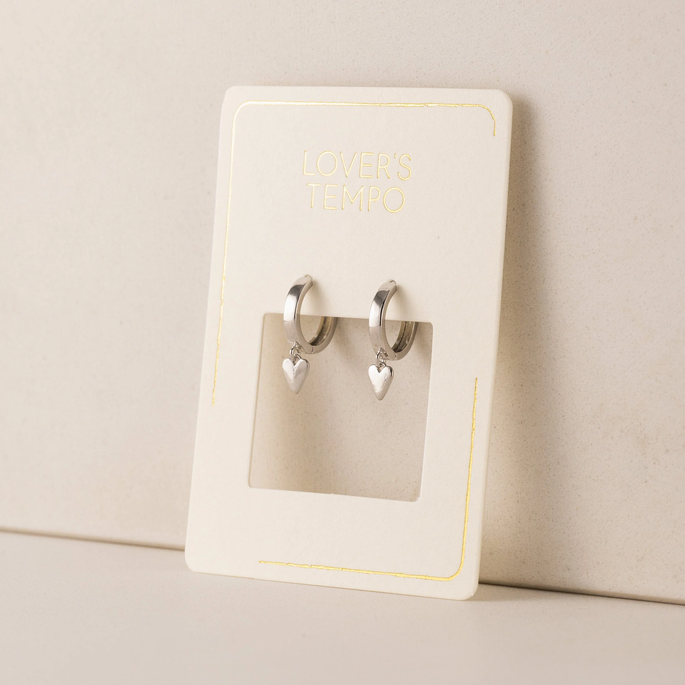 SILVER EVERLY HEART HUGGIE HOOP EARRINGS by LOVER'S TEMPO