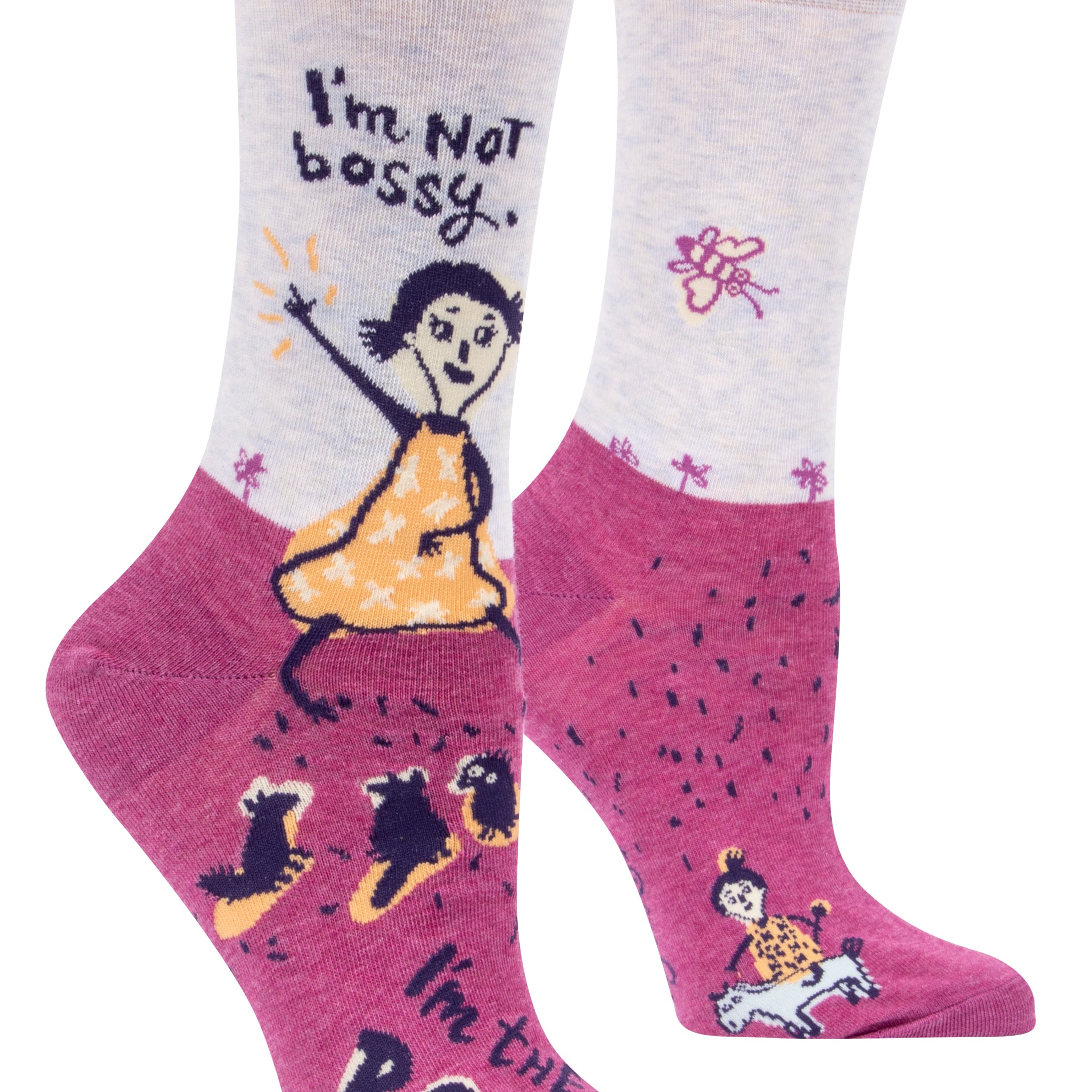 purple and pink socks with a cartoon of a girl with animals and it says i'm not bossy. i'm the boss