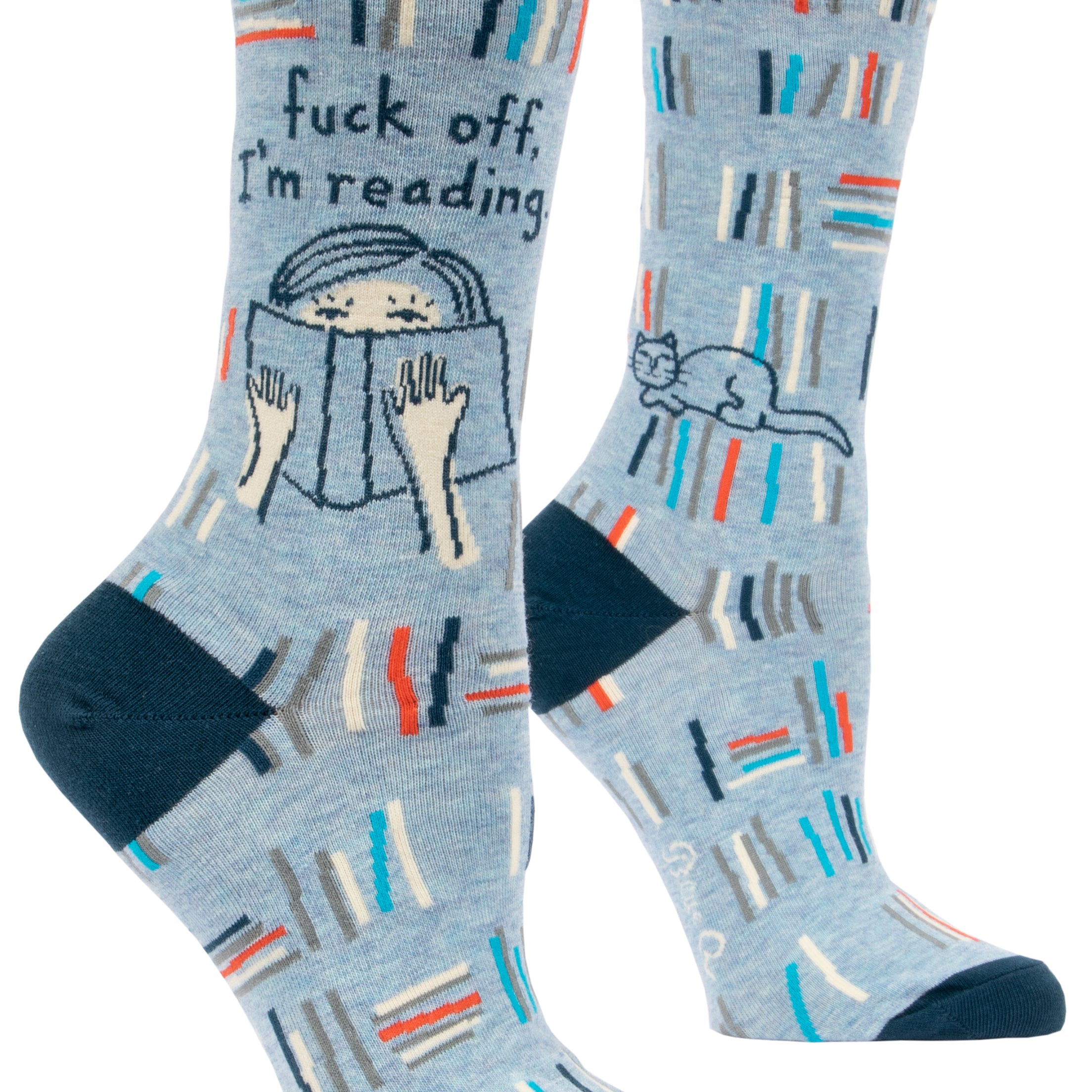 blue socks with multicolour books and a cartoon of  a cat and someone reading above it says fuck off, i'm reading
