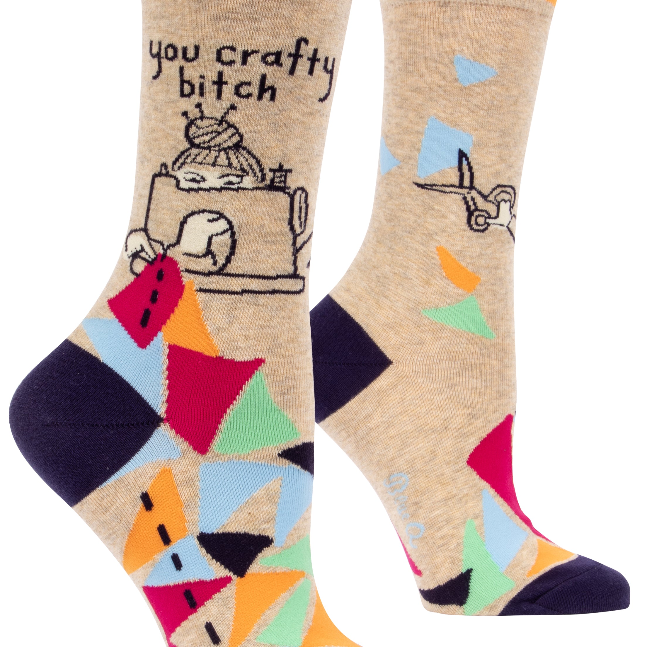 beige socks with multicolour shapes on foot with a cartoon of someone at sewing machine and above it says you crafty bitch