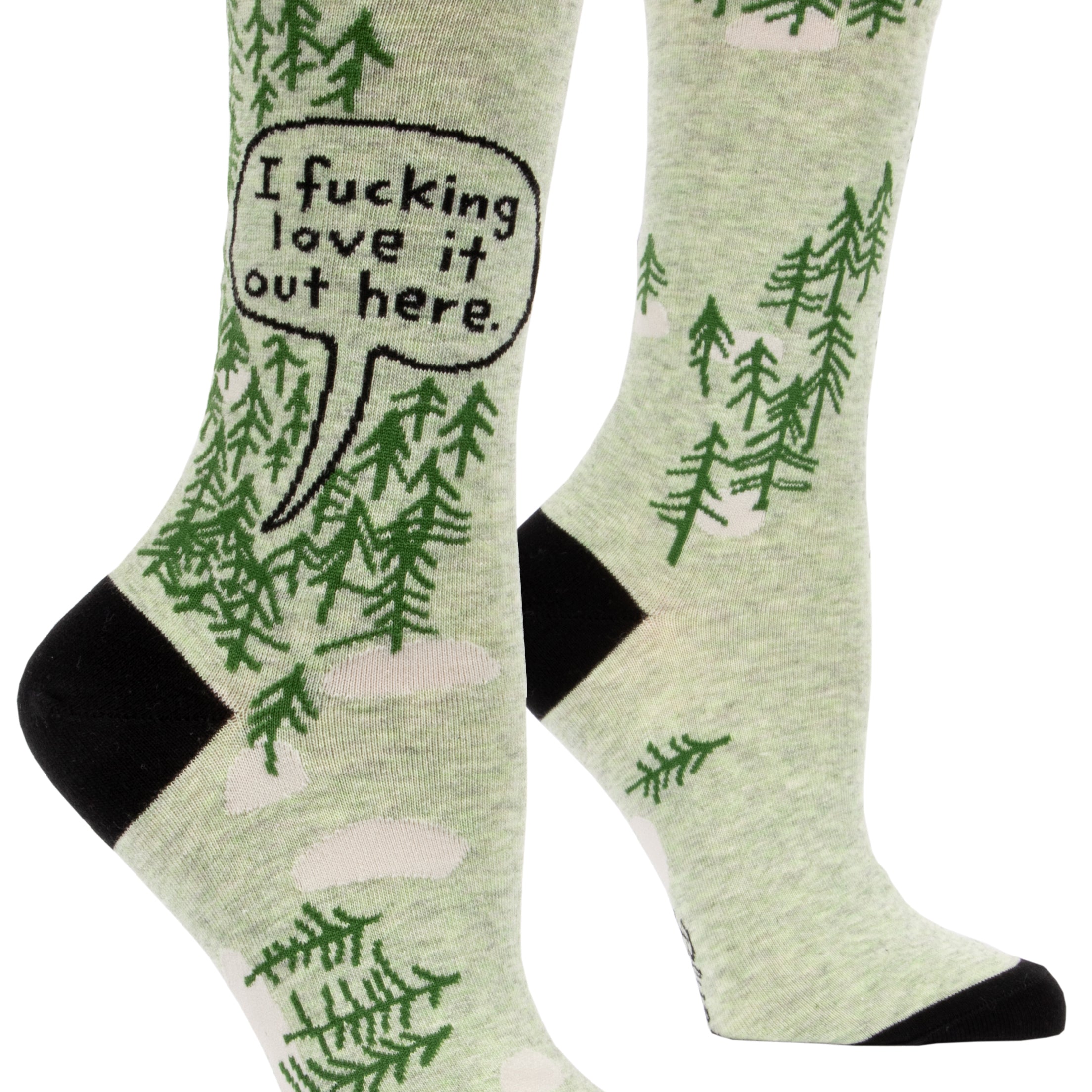 green socks with cartoon trees and black toa and heel on ankle in word bubble it says i fucking love it out here