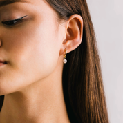 GOLD PEARL AMARI HUGGIE HOOP EARRINGS by LOVER'S TEMPO