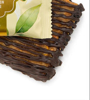 Packaged lemon pistachio brittle BAR with a visible ROGERS label on a white background