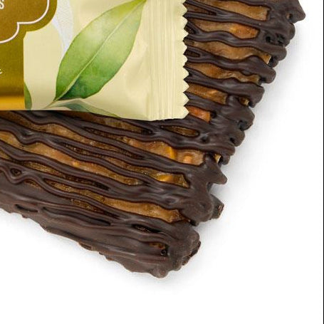 Packaged lemon pistachio brittle BAR with a visible ROGERS label on a white background