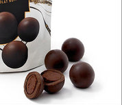 Packaging of Roger's Dark Chocolate Truffle Drops with truffles displayed on a white background