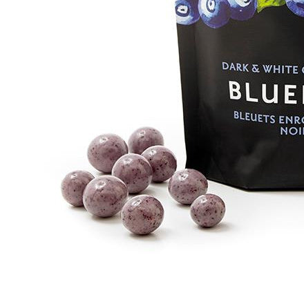 Packaging of Rogers Chocolates dark and white chocolate covered blueberries on a white background