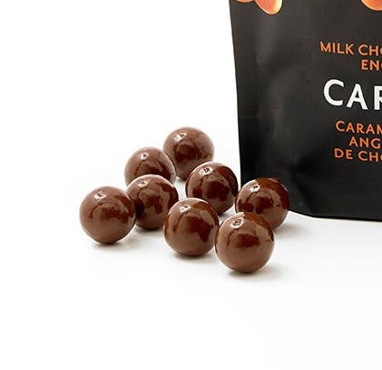 Bag of rOGERS' Caramels with chocolate-covered toffee on a white background