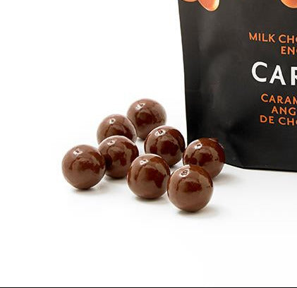Bag of rOGERS' Caramels with chocolate-covered toffee on a white background