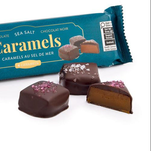 Packaged caramels with a blue wrapper on a white background