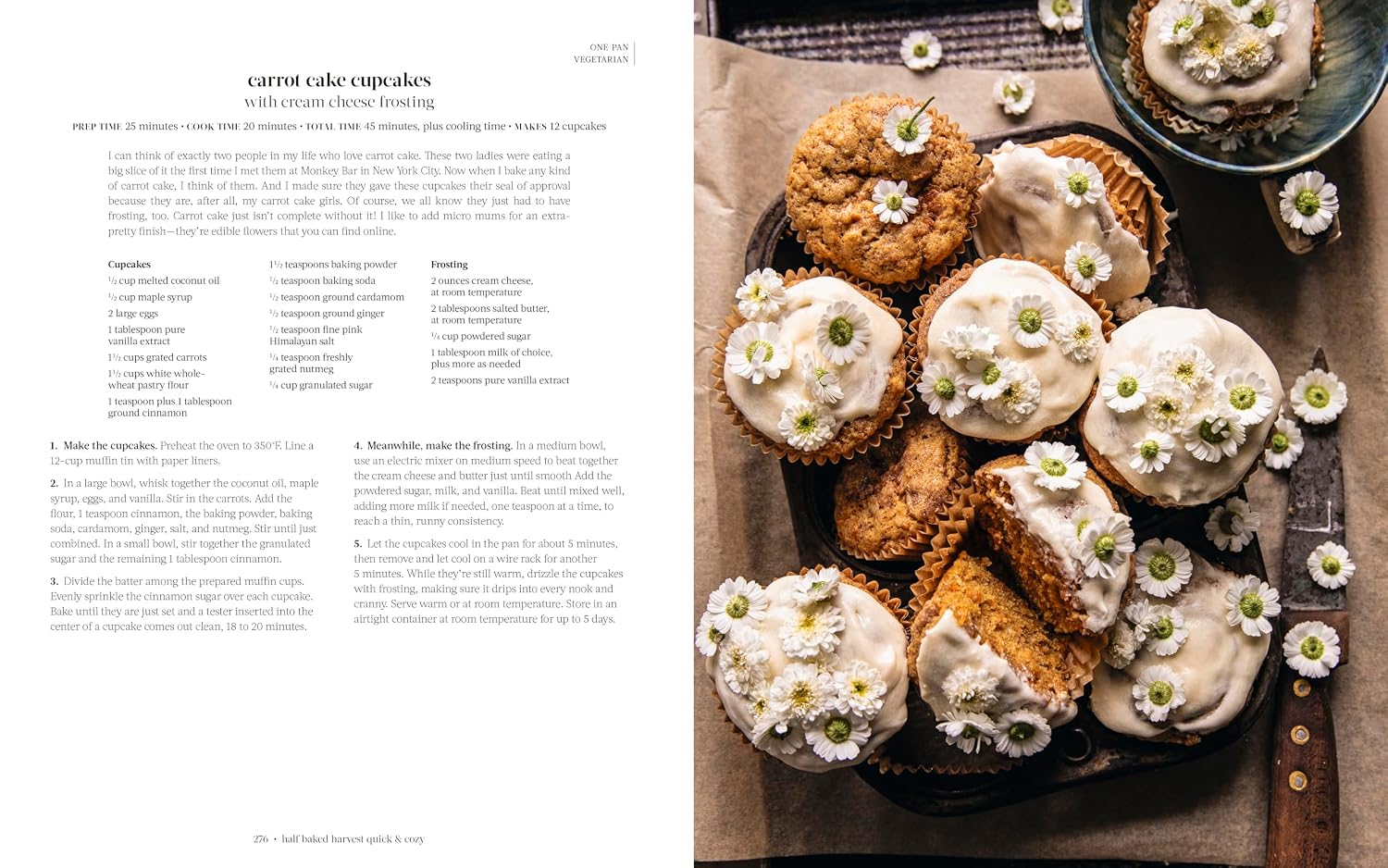 Carrot cake cupcakes with cream cheese frosting on a tray, alongside a recipe.
