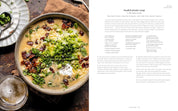 Bowl of loaded potato soup with a recipe on the side