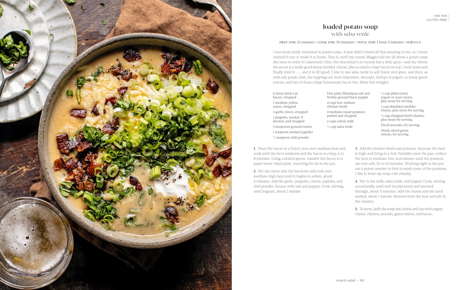 Bowl of loaded potato soup with a recipe on the side