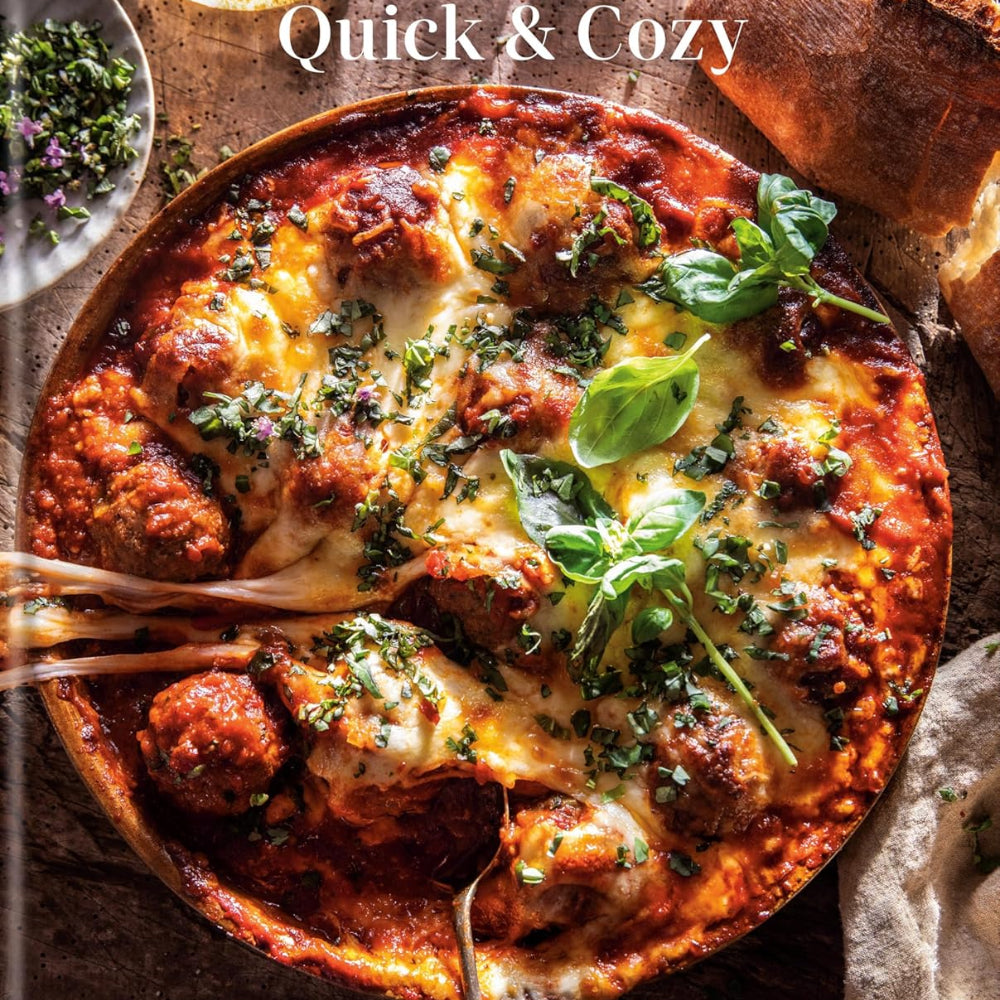 Cookbook cover of 'Quick & Cozy' by Tiegham Gerard featuring a dish with meatballs and cheese.