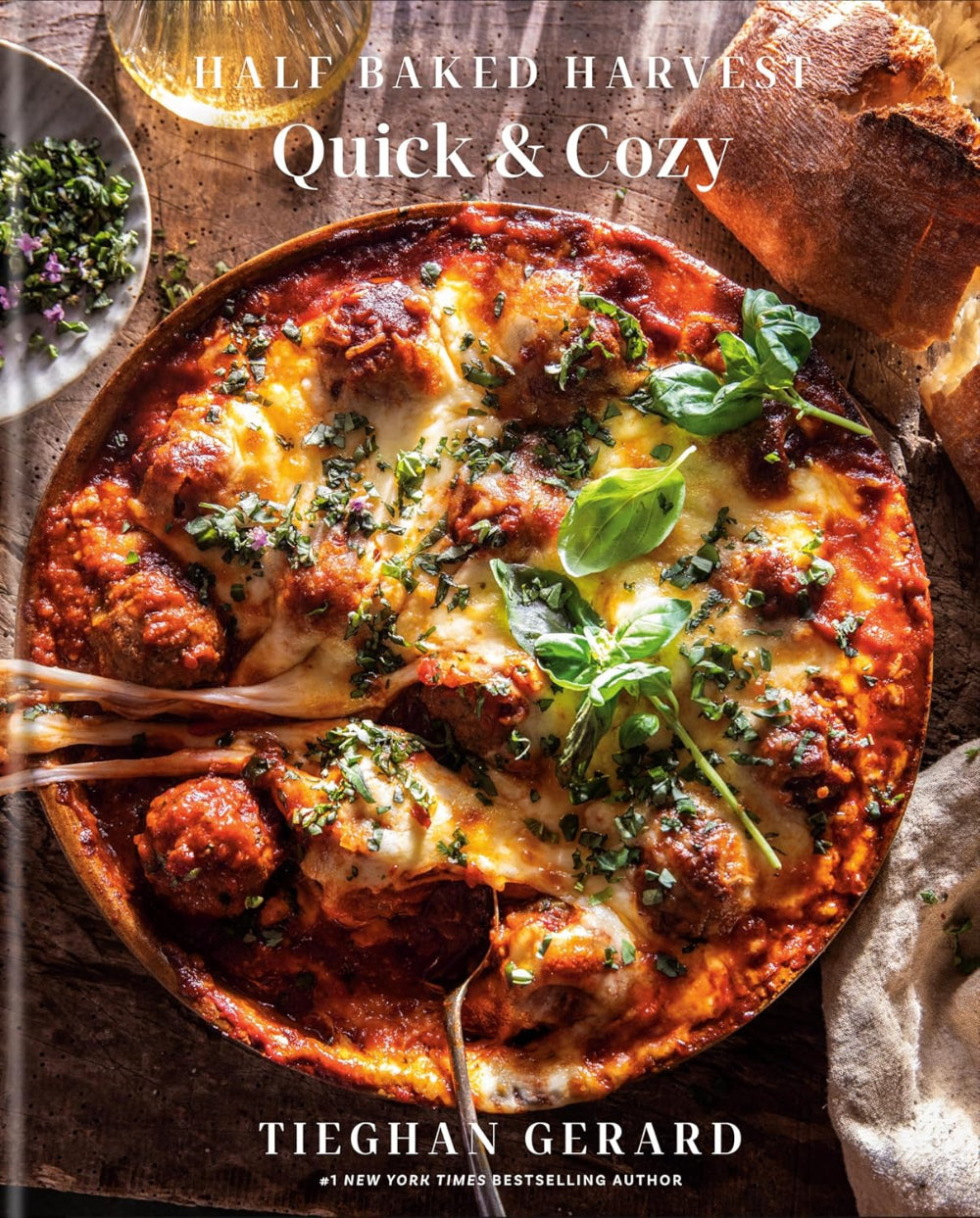 Cookbook cover of 'Quick & Cozy' by Tiegham Gerard featuring a dish with meatballs and cheese.