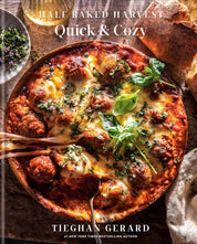 Cookbook cover of 'Quick & Cozy' by Tiegham Gerard featuring a dish with meatballs and cheese.