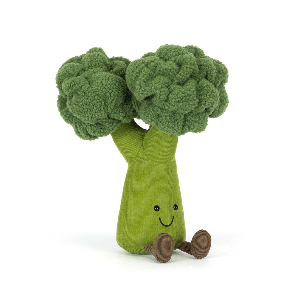 Plush toy shaped like a broccoli with smiling face on a white background