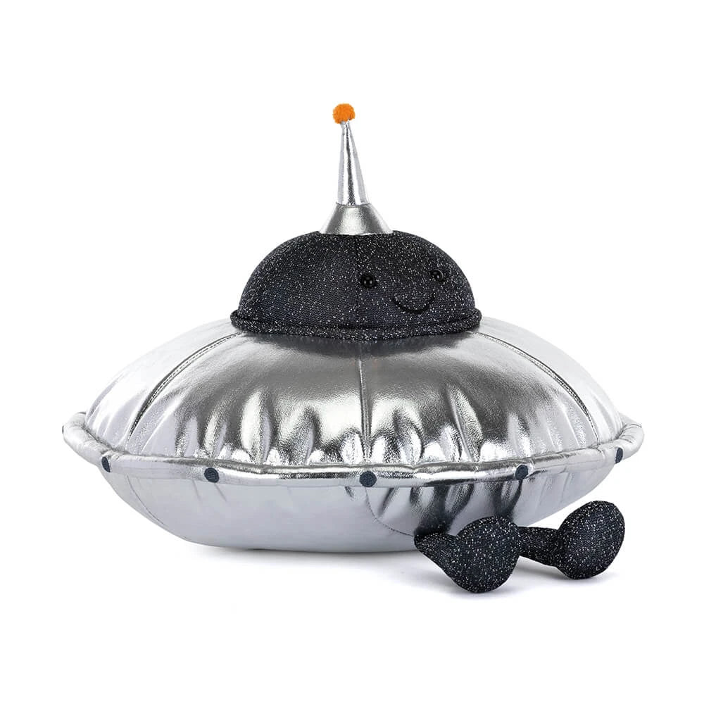 Shiny silver plush space ship with black sparkly smiling face on white background 