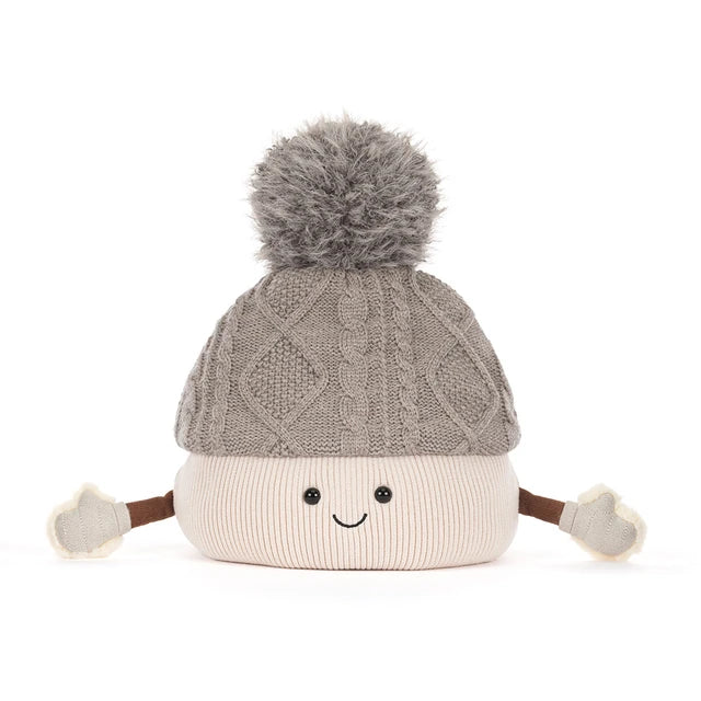 A plush toy toque by jellycat with a gray cable-knit top, a cream ribbed bottom, a gray pom-pom, and small fabric hands and feet, shown on a white background.