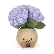 Plush toy purple hydrangea with green leaves in brown pot with smiling face on white background