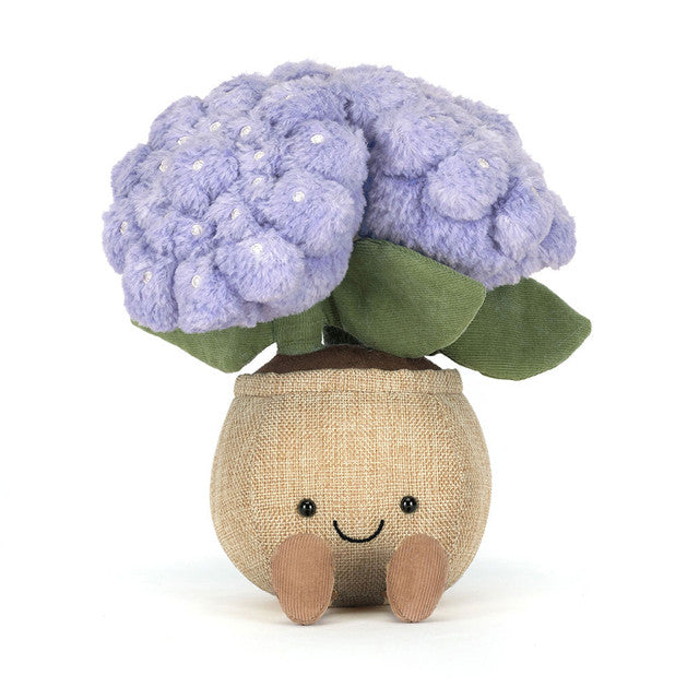Plush toy purple hydrangea with green leaves in brown pot with smiling face on white background