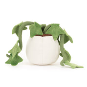Plush toy potted plant with green leaves and a white pot on a white background