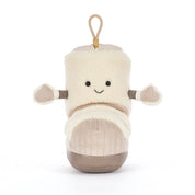 A plush boot-shaped jellycat brand plush toy with a cream sherpa upper, beige corduroy-like lower section, and a tan hanging loop at the top, shown on a plain white background.