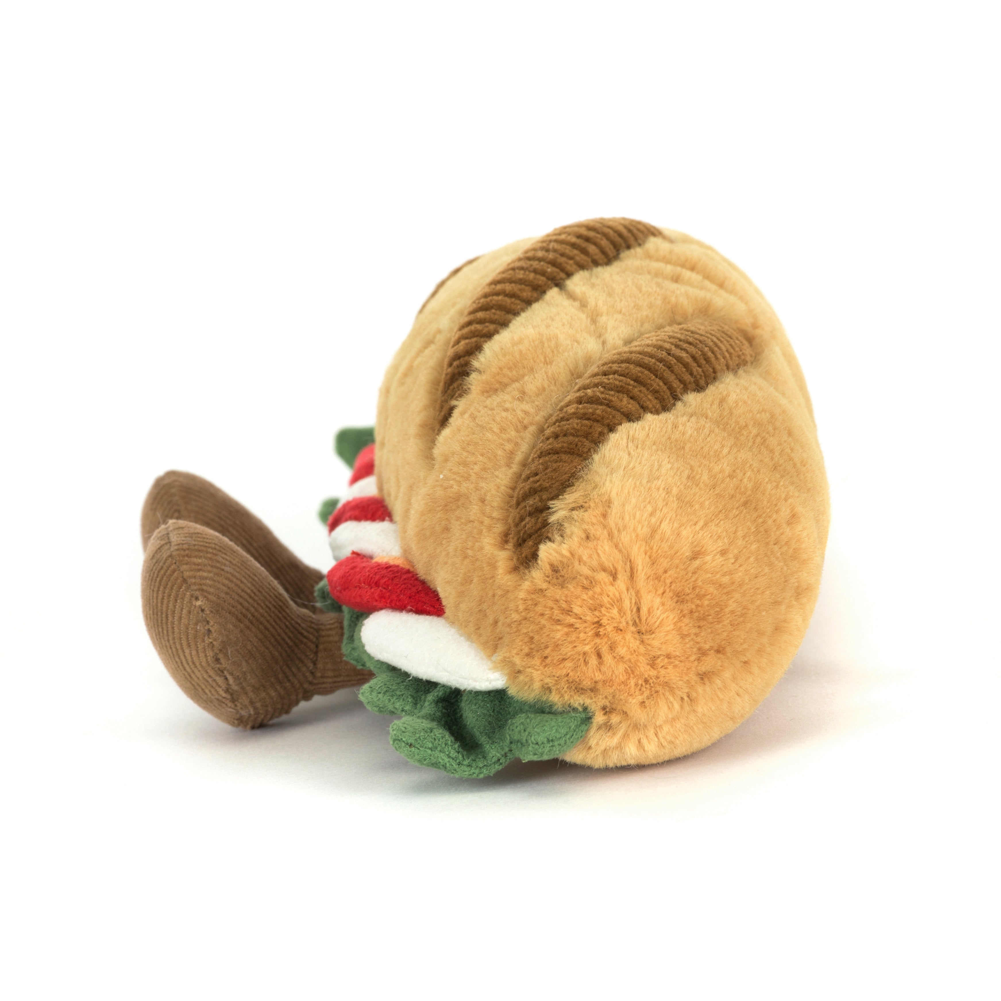 side view of plush toy caprese sandwich on white background