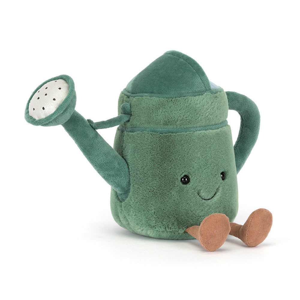 Plush toy green watering can with a smiling face on a white background