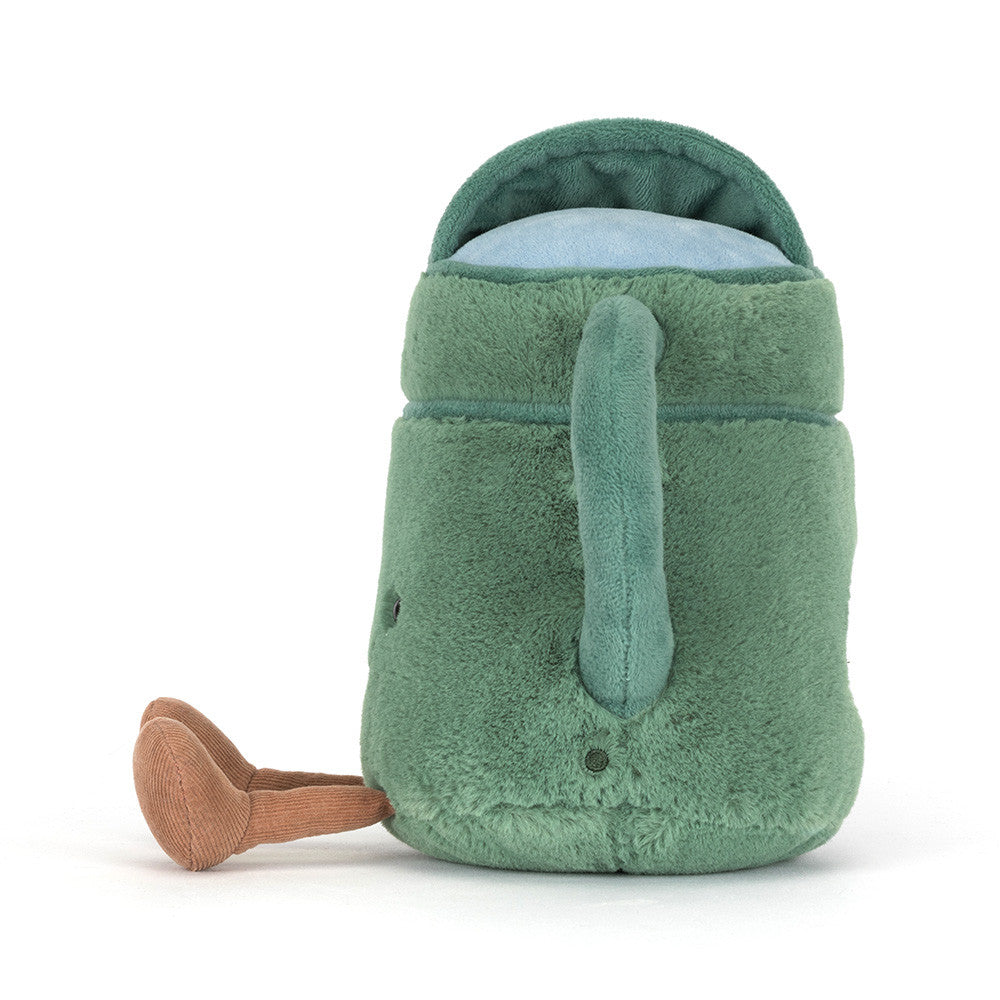 Plush toy green watering can with a smiling face on a white background