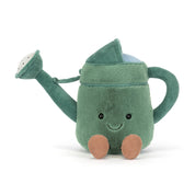 Plush toy green watering can with a smiling face on a white background