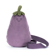 Plush bum bag purse by jellycat shaped like an eggplant with a smiling face on a white background