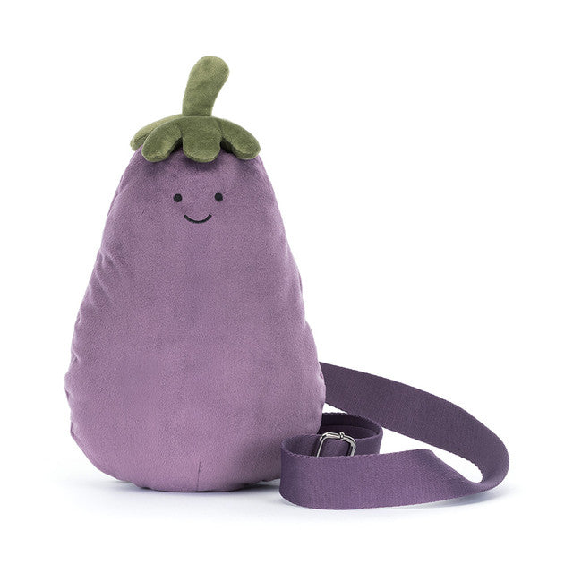 Plush bum bag purse by jellycat shaped like an eggplant with a smiling face on a white background