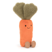 Stuffed toy plush carrot with a smiling face on a white background