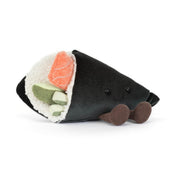 Plush jellycat toy shaped like a sushi roll with black exterior, pink and green fillings on a white background