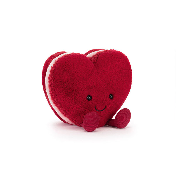 Red heart-shaped macaron plush toy with a smiley face on a white background