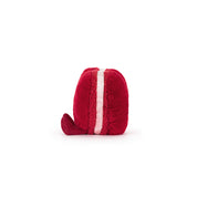 Red plush toy side view of heart macaron on a white background