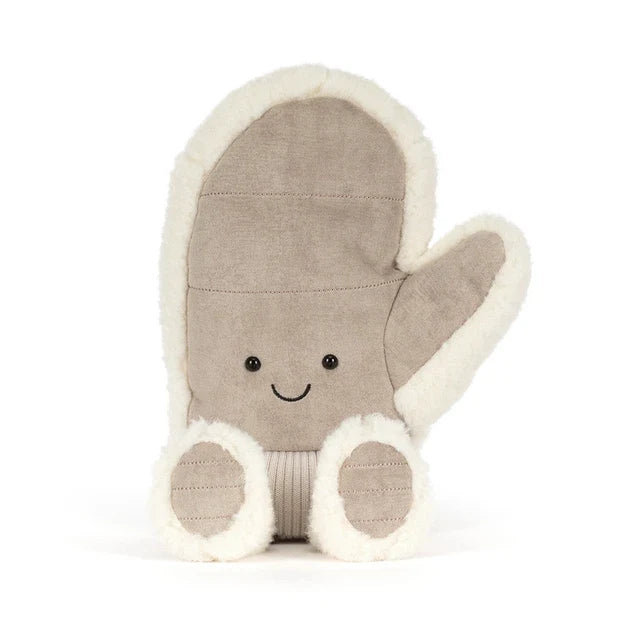 A plush winter mitten jellycat toy in a warm taupe-brown fabric with cream sherpa trim, featuring a simple embroidered smiley face and small feet, shown on a clean white background.