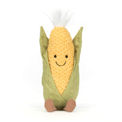 Plush toy corn on the cob with a smiling face on a white background