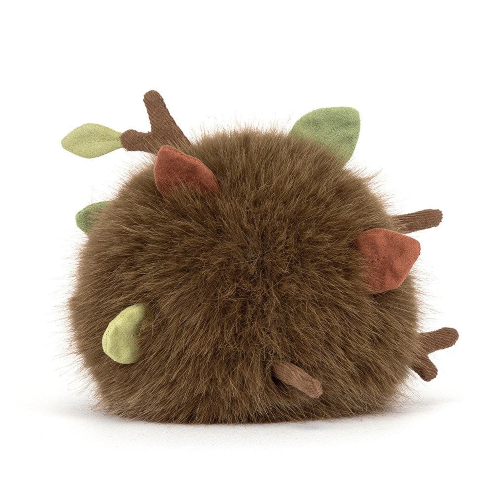 back view of jellycat forest floor with fuzzy fur and leaves and sticks and cute face and legs on white background
