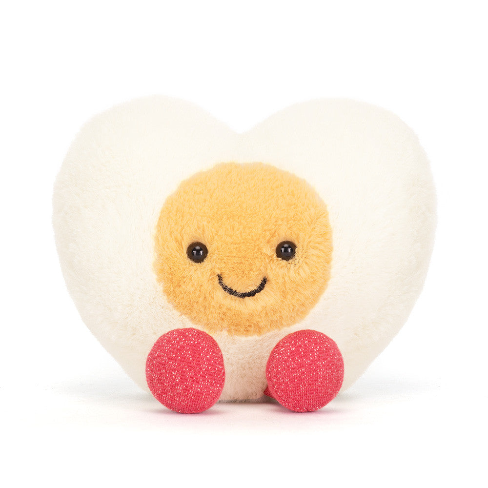 heart shaped boiled egg plush with smiling face on white background