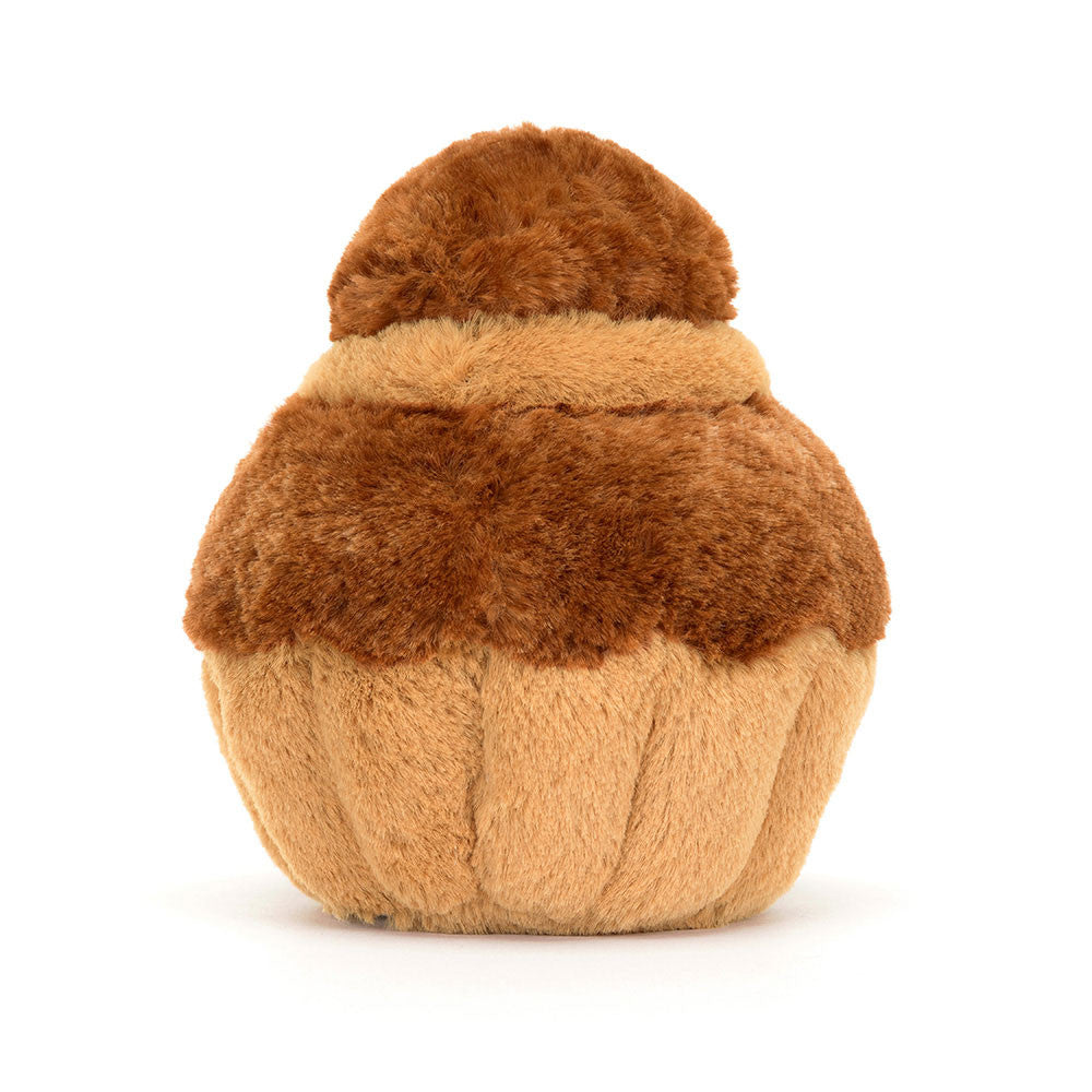 Jellycat plush toy resembling a brown and beige brioche pastry with a smiling face, corduroy legs, and a soft textured surface back view