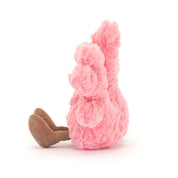 side view Pink jellycat plush coral toy with a smiling face on a white background