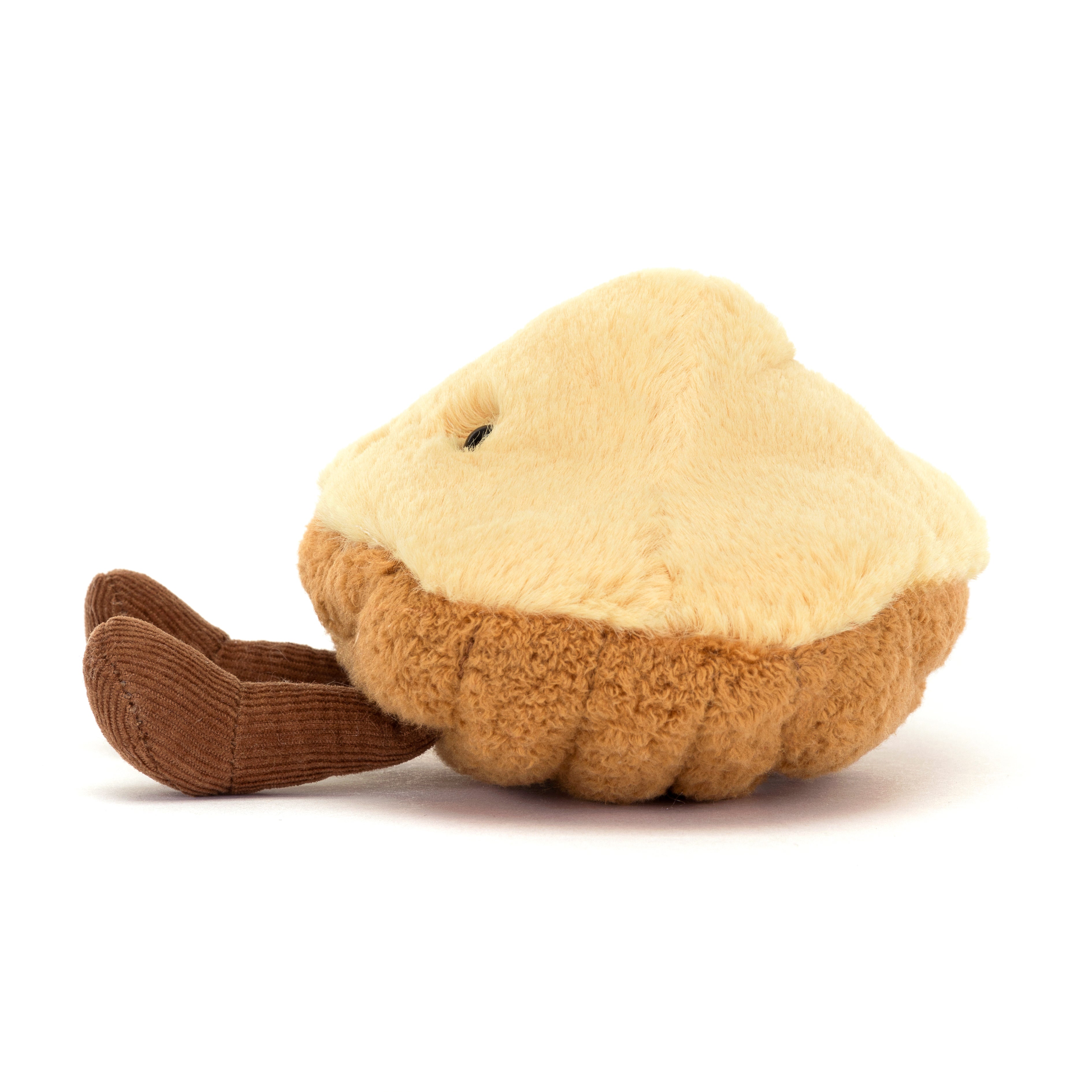 smiling plush madeleine pastry toy on white background