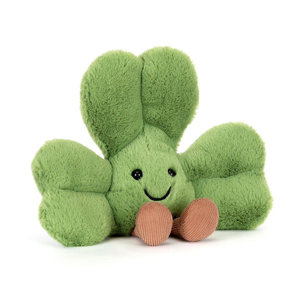 green plush toy shamrock with smiling face on white background