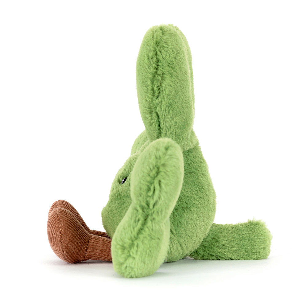 green plush toy shamrock on white background