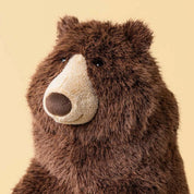 close up of A large jellycat brown plush stuffed bear to