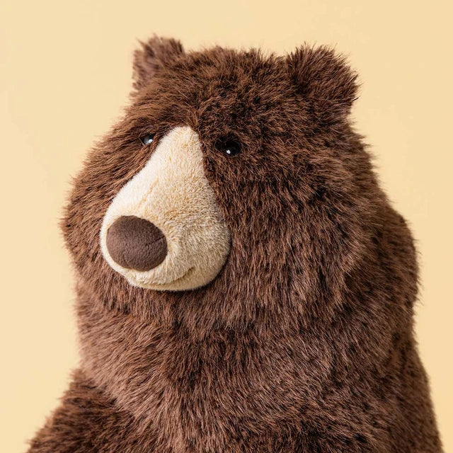 close up of A large jellycat brown plush stuffed bear to