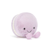 Plush lavender macaron toy on white background