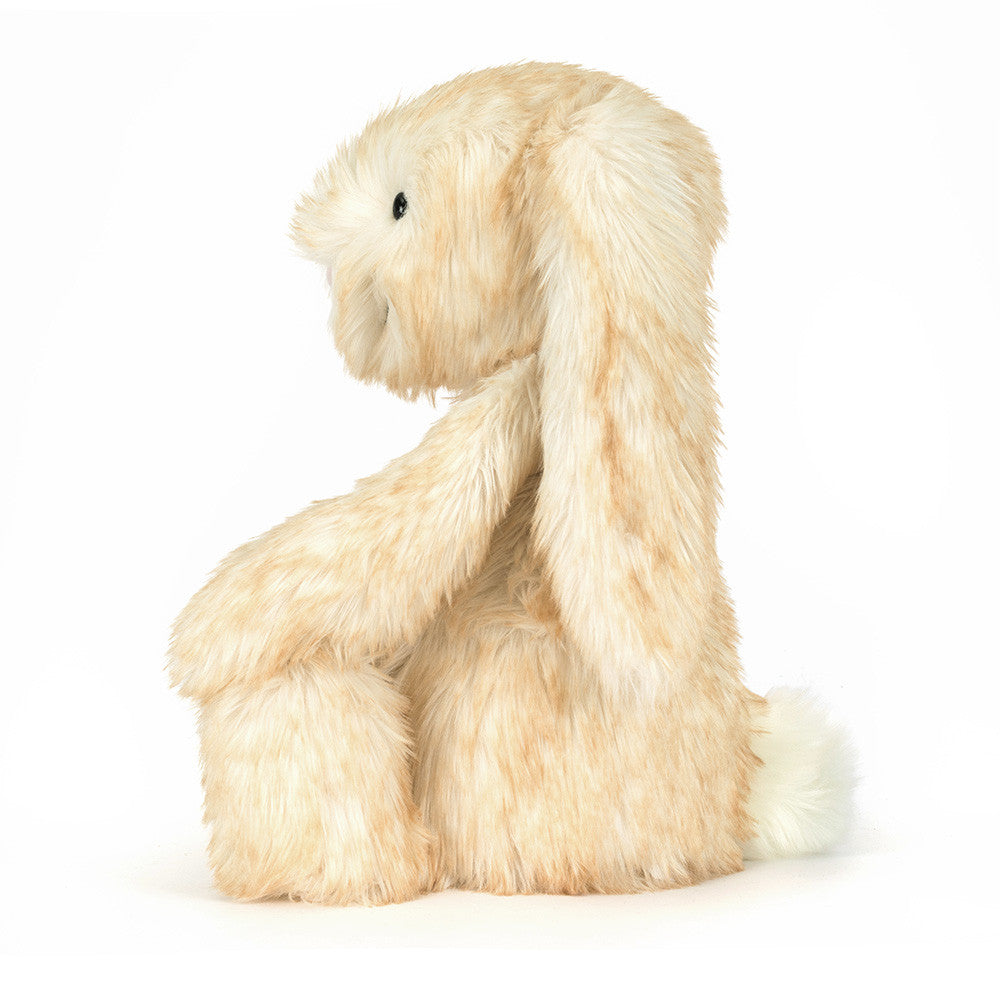 white blush tinted bunny plush toy on a white background